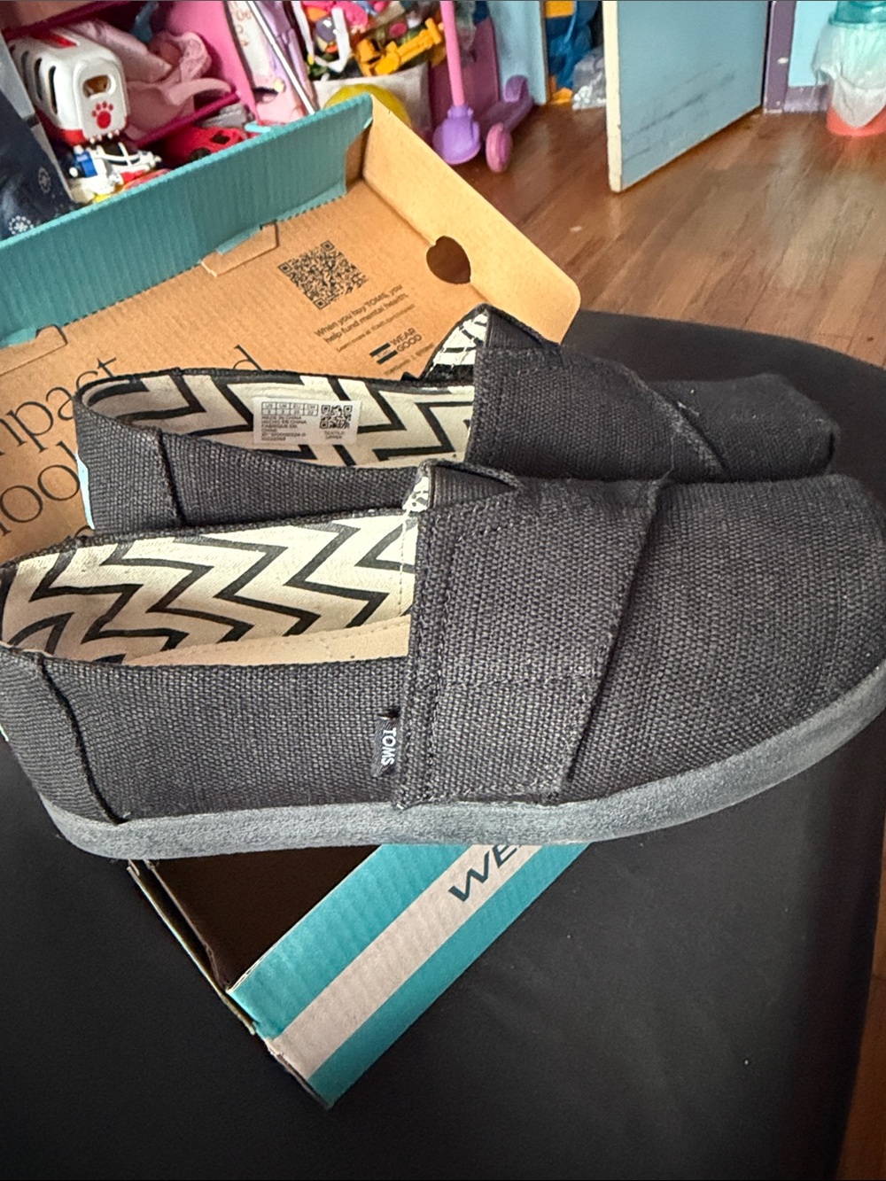 Toms Black Slip-On Canvas Shoes with Chevron Lining